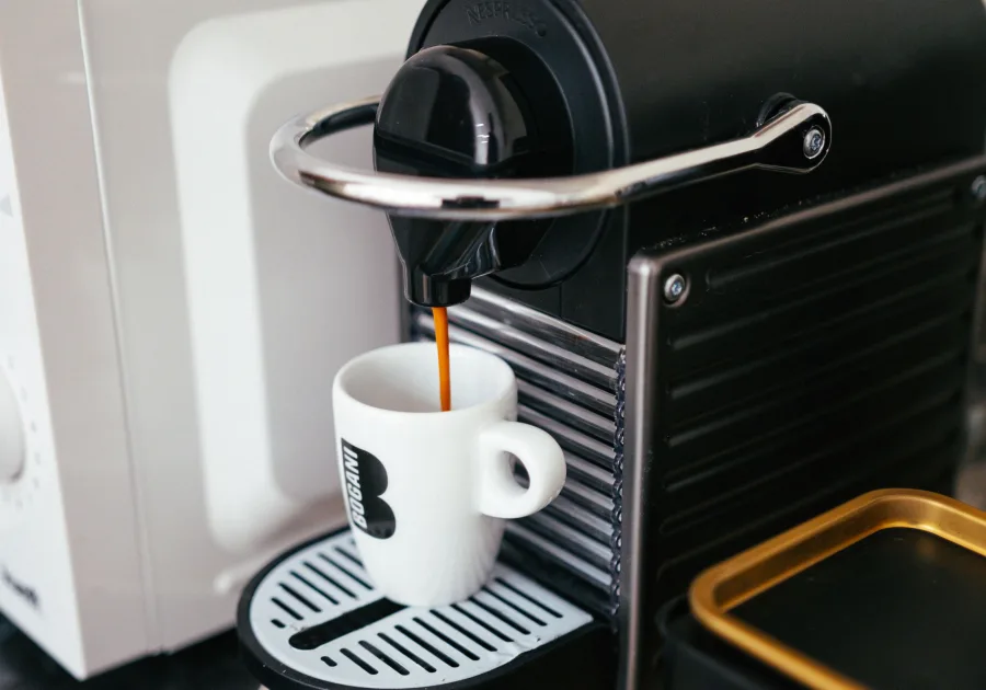 Built-in coffee machine set into kitchen cabinetry