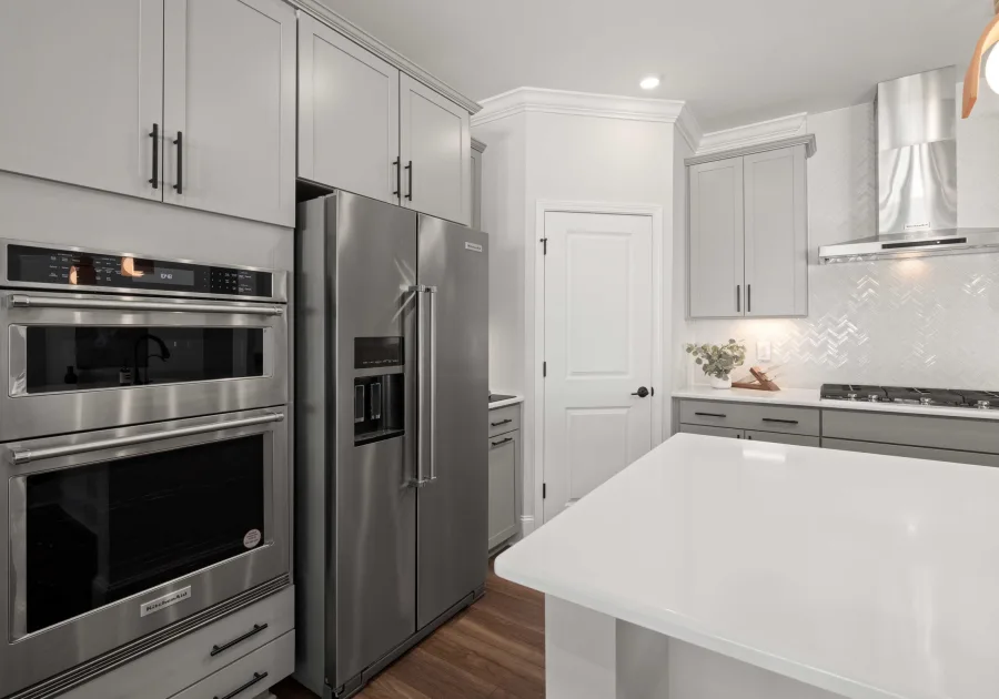Professional stainless steel range built into a home kitchen