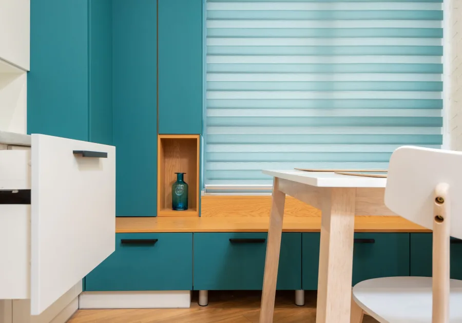 Run of built-in kitchen cabinetry with an integrated drawer front