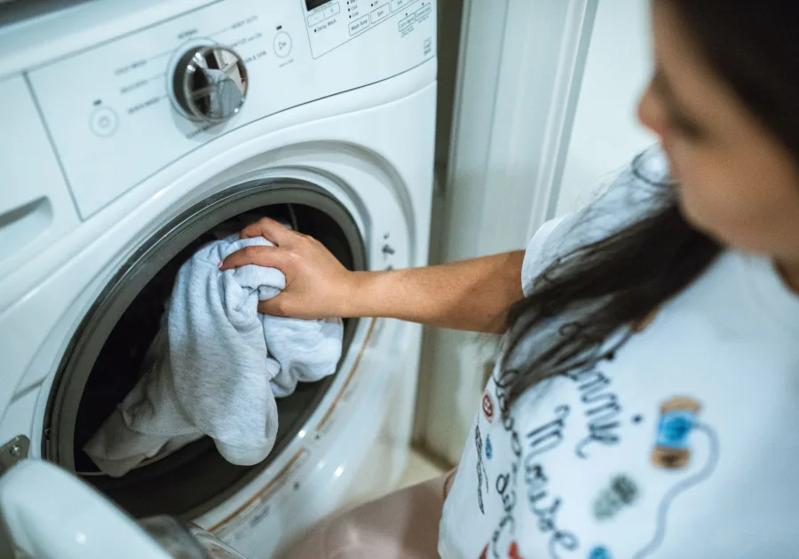 Front load washing machine in a tidy home laundry room