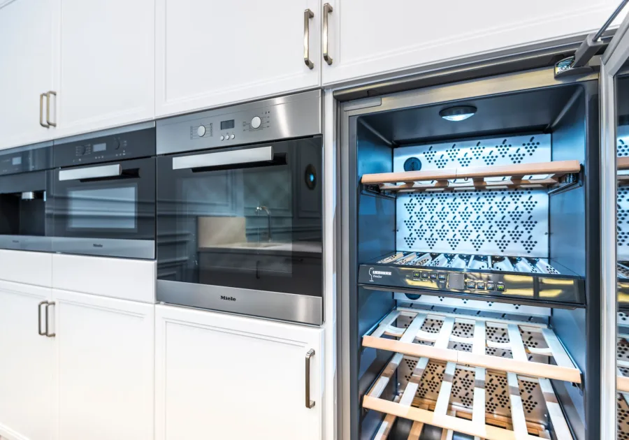 Wine cooler with bottles resting on wooden shelves